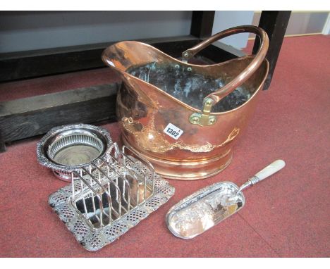 A XIX Century Copper Coal Helmet, mother of pearl handled crumb scoop, toast rack, plate on copper bottle coaster, (4).