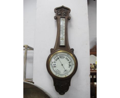 British Made Oak Banjo Barometer, with poker work carving, thermometer to neck, 79cm high.