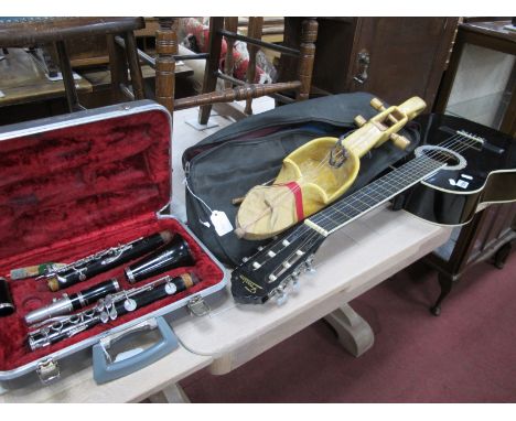 Boosey &amp; Hawkes Regent Five Piece Clarinet, Millet cased stringed instruments, Freedom acoustic guitar. (3)