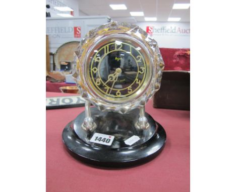 Majak Mantle Clock, made in USSR with glass dial surround on circular black plastic base, 19cm high.