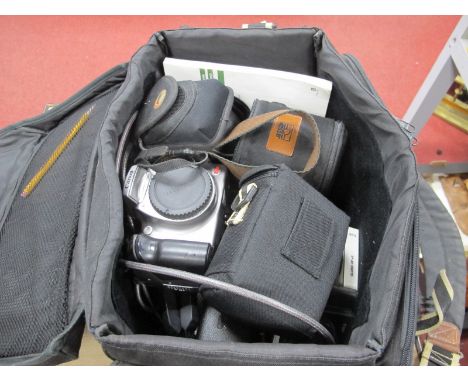 Canon Eos Digital Camera, Canon lens EF 20mm, etc in a case.