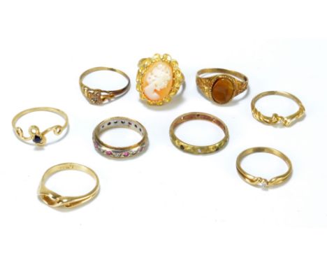 Eight various 9ct yellow gold dress rings to include an oval cameo set example, a tiger's eye set signet ring and a cubic zir