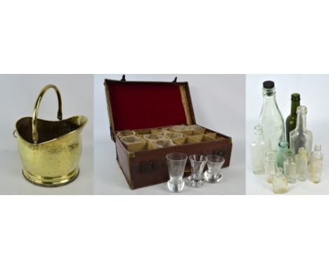 A collection of mainly Masonic firing glasses most with Masonic emblems and some with inscriptions, all nine in a travelling 