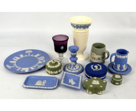 A collection of Wedgwood including predominantly blue jasperware, an 'Embossed Queensware' vase and a commemorative purple gl