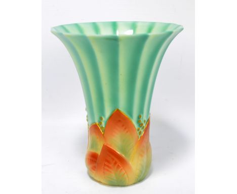 A Royal Worcester Art Deco style faceted tapering vase with impressed mould motifs to lower body, marked in puce to base, num