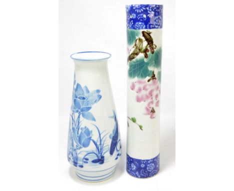 A modern Japanese sleeve vase, transfer printed and decorated with fruit, height 48cm and a tapering modern blue and white va