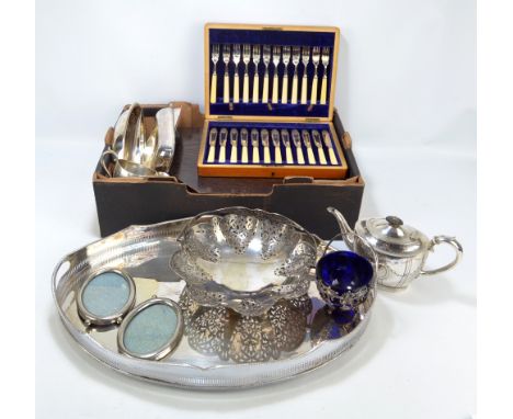 A group of electroplated items to include an oval galleried tray, two entree dishes, a teapot with matching cream jug and a c