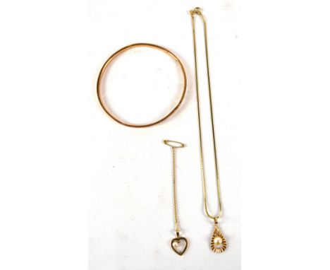 A 9ct yellow gold circular bangle, diameter 7cm, an 18ct yellow gold drop pendant, length 2.5cm, on a 9ct yellow gold chain, 