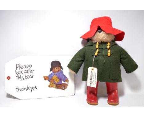 A c.1970s Gabrielle Designs Paddington Bear soft toy in blond mohair/plush with glass eyes and plastic nose, dressed in red h