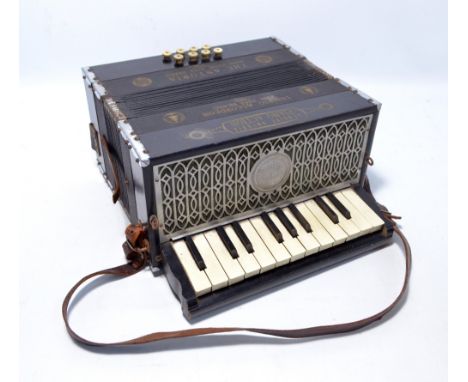 An Antoria 'Ludwig' piano accordion with leather straps.