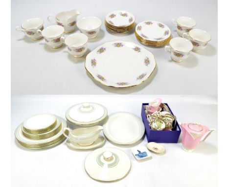 A Royal Doulton six setting dinner service comprising dinner plates, side plates, salad plates, a pair of tureens with cover,