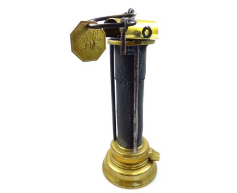 A circa 1880-1910 Davy miner's safety lamp, probably by E. Thomas & Williams, height 23.5cm, with Thorne Colliery tally no. 0
