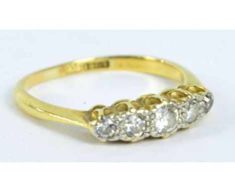 An 18ct yellow gold graduated five stone diamond ring, size K, approx 2.2g.