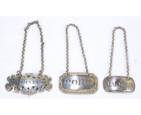 CHARLES REILLY & GEORGE STORER; a Victorian hallmarked silver 'whisky' label of shaped oval form with pierced border, London 