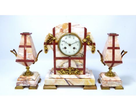 A French Art Deco marble and gilt metal mounted three piece clock garniture, the shaped clock with eight day movement and Ara