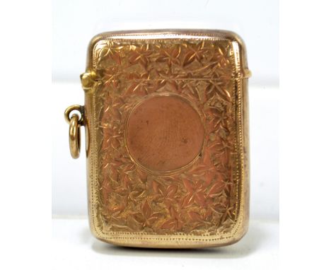 WILLIAM AITKEN; an Edward VII hallmarked silver gilt vesta case overall engraved with foliate motifs centred with a circular 