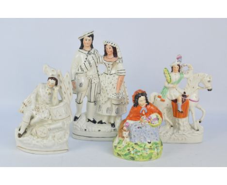 Four 19th century Staffordshire figures to include 'Peace' (af) and a little girl wearing a red cloak (4).
