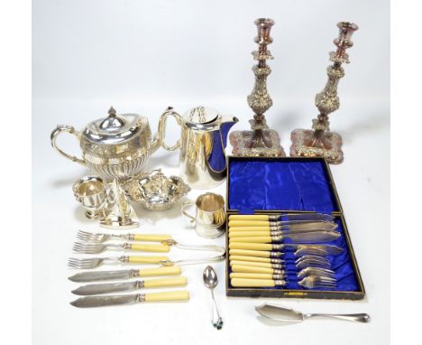 A quantity of electroplated items including a pair of candlesticks, basket, teapot, etc.