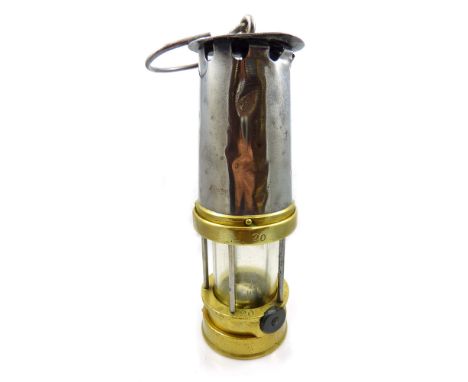 A circa 1910 Patterson of Newcastle-on-Tyne flame miner's safety lamp, Type A1, electrically lit, height 24.5cm.