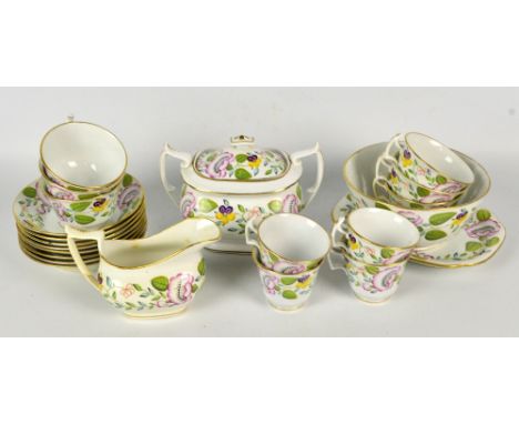 A 19th century hand painted floral decorated part tea set comprising a sucrier, a jug, a slop bowl, eight saucers, six larger