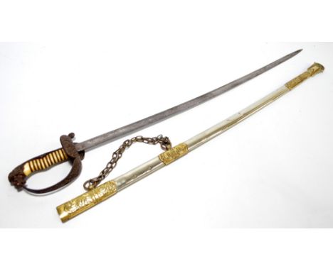 A German naval sword with lion head pommel, wire bound ivory grip, hinged knuckle guard and engraved blade in ornate metal sc