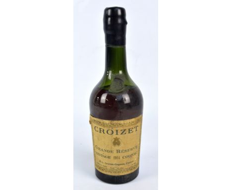 A bottle of Croizet Grande Réserve Vintage 1914 cognac, liquid level at base of shoulders.