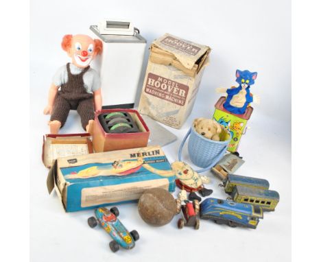 A quantity of mid-20th century toys including a tinplate clockwork train engine 'Golden Eagle' with two carriages and a tinpl