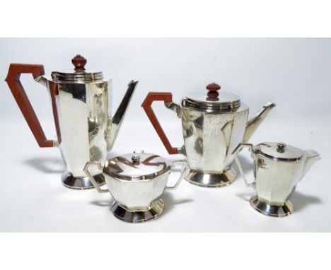 DEAKIN & FRANCIS LTD; a George VI hallmarked silver Art Deco style four piece tea set comprising tea and hot water pots, crea