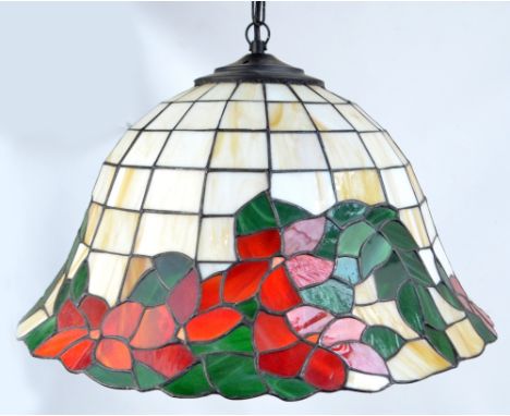 A 20th century stained glass lamp shade in the Tiffany style, width 47cm.