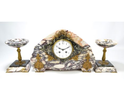 A French Art Deco three piece marble clock garniture with circular white enamel dial set with Arabic numerals and indistinctl
