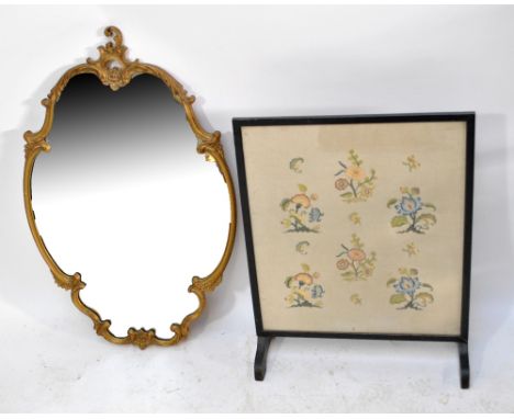 A Continental walnut ladder back elbow chair, a Rococo style mirror and an ebonised fire screen (3).
