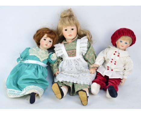 A group of bisque porcelain headed dolls with glass eyes and painted features, some with open mouths and teeth, with ceramic 