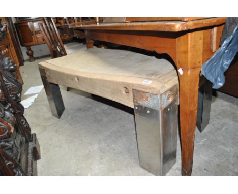 A vintage rectangular butchers block now set with brushed aluminium legs converting it into a coffee table, 123 x 62cm.