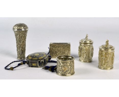 A pair of circa 1900 Indian peppers of cylindrical form, embossed with various deities, height 7.5cm, a Persian engraved whit