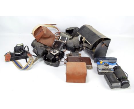 A collection of cameras to include Polaroid 'Square Shooter 2', Kodak 'Instamatic' and Olympus 'Trip 35' examples.