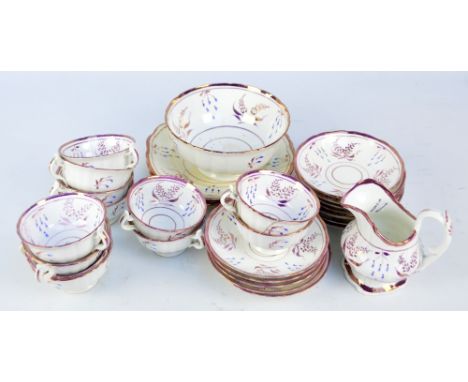 A 19th century lustre ware part tea service, comprising eleven cups (one af), twelve saucers, two sandwich plates, a serving 