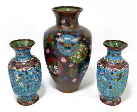 A pair of 19th century Chinese cloisonné enamel decorated vases of ovoid faceted forms, height 17cm and a further similar lar