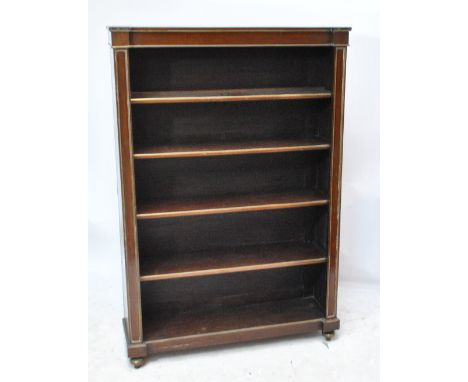 A 19th century mahogany four shelf bookcase with brass detail, raised on peg feet, width 109cm.