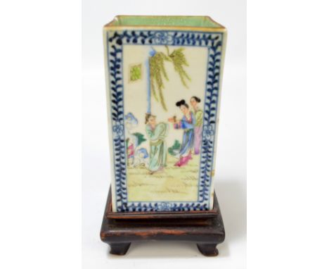 A circa 1900 Chinese rectangular sectioned vase with blue and white painted border and four main panels depicting figures in 