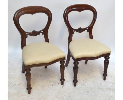 A set of six mahogany reproduction balloon back chairs with fluted and ring turned front legs.