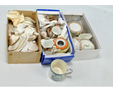 A child's toy dinner service decorated with foliate border comprising plates and platters, lidded serving dishes and a sauce 