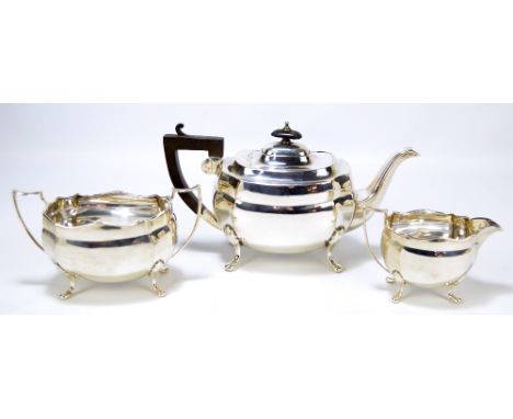 JOHN EDWARD BINGHAM; a George V hallmarked silver three piece tea set, Sheffield 1923, length of teapot 28.5cm, combined appr