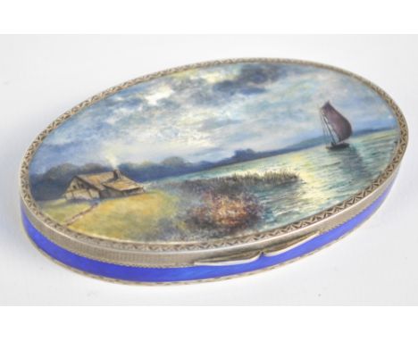 PH VOGEL & CO (probably); A George V hallmarked silver oval box with enamelled hinged lid painted with lake landscape with bo