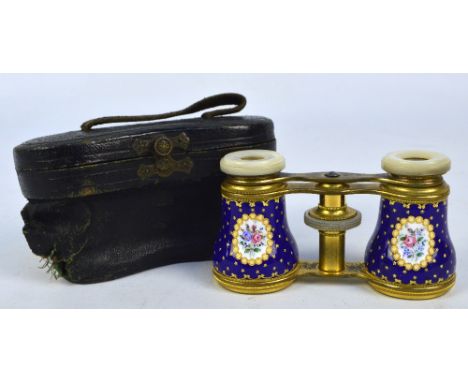 A pair of late 19th/early 20th century French brass and enamel opera glasses with mother of pearl eyepieces and gilt and flor
