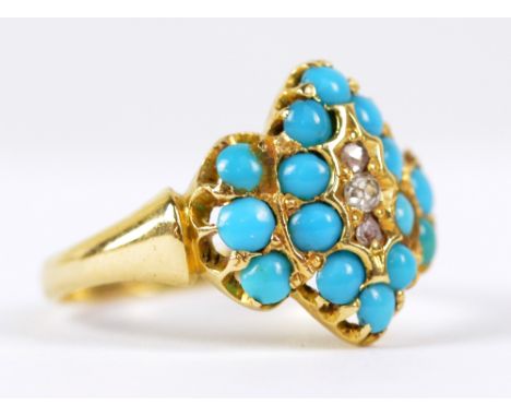 A Victorian yellow gold ring set with three diamond chips, surrounded by numerous turquoise cabochons (one missing), size M, 