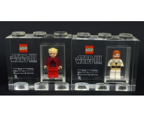 Two Lego for TT Games Minifigure acrylic trophy bricks, Emperor Palpatine and Obi Wan Kenobi, from the Star Wars III: The Clo