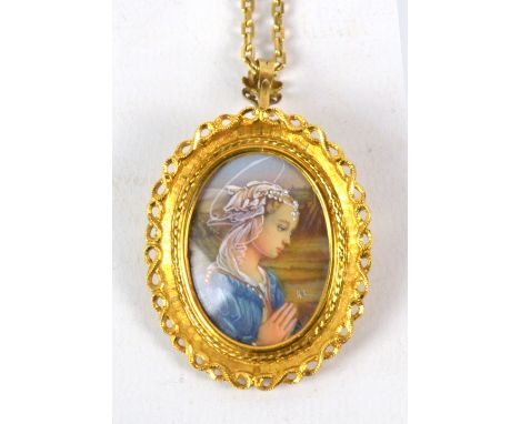 An 18ct yellow gold brooch/pendant, set with a portrait miniature of a female saint, length 4.5cm, on a 9ct yellow gold chain