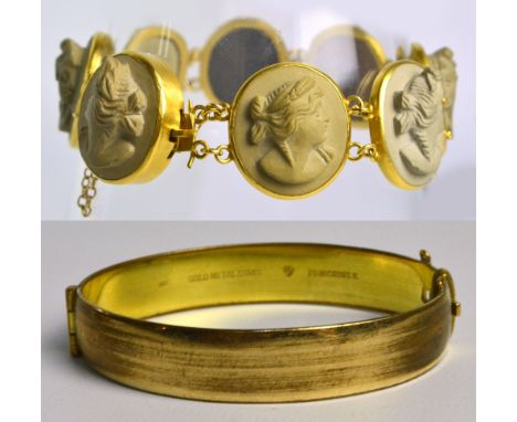 A modern yellow metal mounted sectional oval vulcanite cameo bracelet, length 18cm, with safety chain and a gold plated snap 