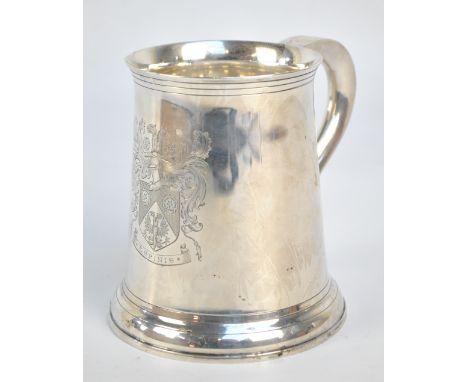 WAKELY & WHEELER; a George V hallmarked silver tankard of plain tapering form, centred with an engraved coat of arms inscribe