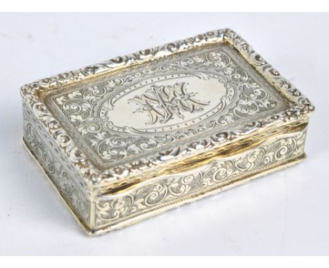 THOMAS HAYES; a Victorian hallmarked silver snuff box of rectangular form overall engraved with foliate scrolls and foliate m